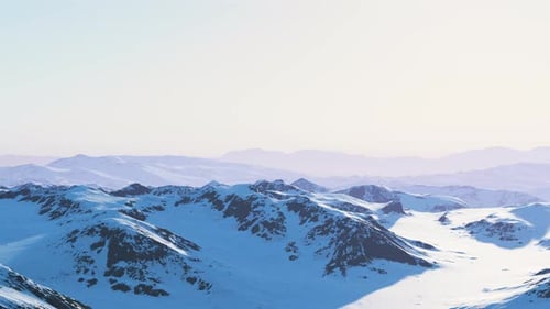 A Snowcovered Mountain Range with Majestic Peaks in the Distance