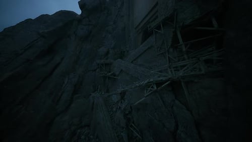 Abandoned Construction Site on a Rocky Cliff During Twilight Hours