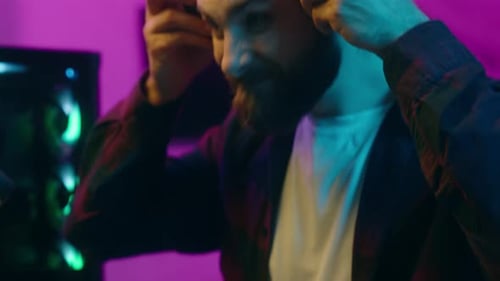 Relaxed Caucasian Man Blogger Prepare for Stream Virtual Game Tournament Put on Headphones