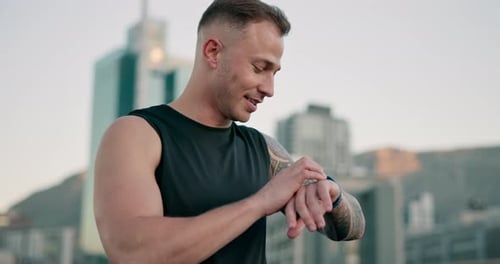 Man Checking Smart Watch After Urban Workout