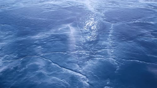 Thin Ice Forming On Water Surface In Early Morning