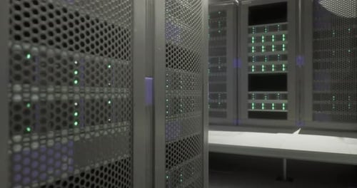 Data Center with Multiple Server Racks Illuminated By Green Lights