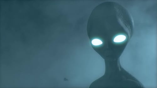 Scary Gray Alien Stands and Looks Blinking on a
