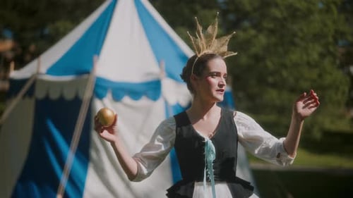 Actress In Costume Holding A Golden Apple