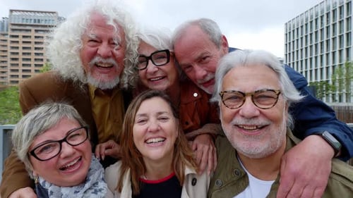 Portrait of Happy Diverse Senior Friends Standing Together at City
