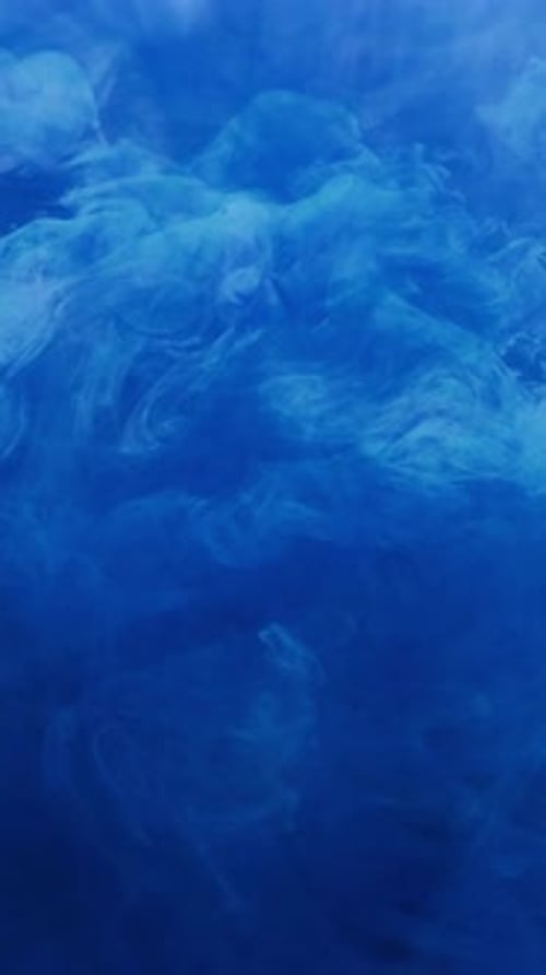 Abstract Blue Ink Flowing in Fluid