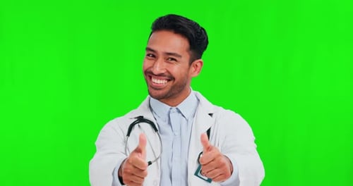 Thumbs up, green screen and man doctor with thank you sign pointing isolated in a studio background