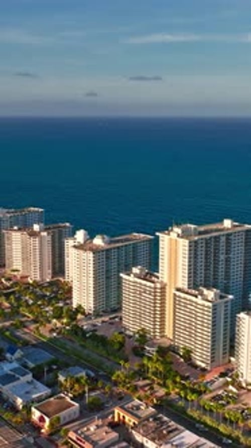 Aerial view of Miami skyline above the ocean at sunset