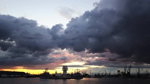 Dramatic Harbor View with Silhouettes at Sunset or Sunrise