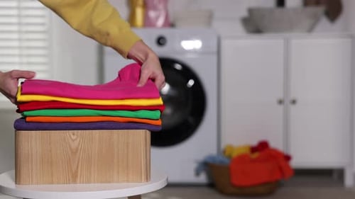 Folding Laundry in Bright Laundry Room, Home Chore