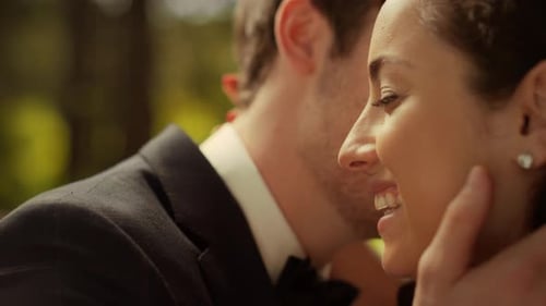 Portrait of Charming Bride and Groom Talking on Wedding Ceremony in Garden