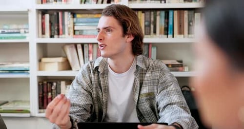 Library, study and student man in group with conversation and book planning for college project