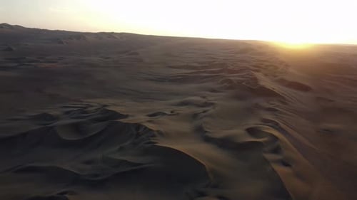 Aerial of Huacachina, Peru, Highlighting the Lagoon Amidst Vast Sand Dunes