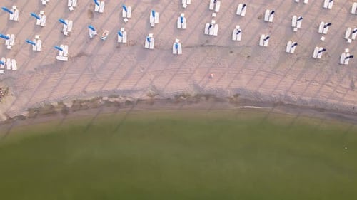 Drone view of beautiful beach sea waves breaking on sandy coastline. Aerial shot of beach ocean wate