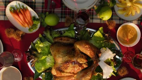 Vertical Of Roasted Turkey And Table Full Of Food For Thanksgiving Day