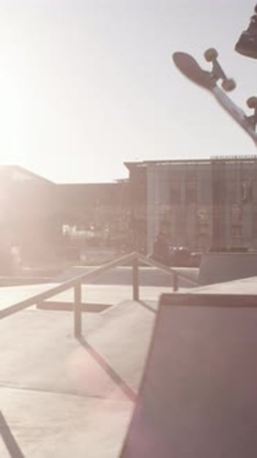 Skater, accident and man in city, fail and training for technique, lens flare and fitness