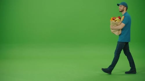 Green Screen Delivery Man Brings Paper Bag with Food