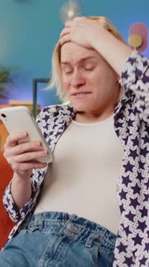 Frustrated Woman Reacting Negatively to Phone News