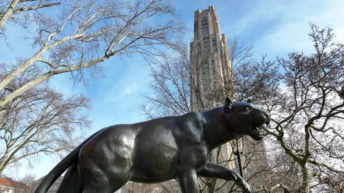 University of Pittsburgh Pitt Panther and Cathedral of Learning. Cinematic aerial establishing shot
