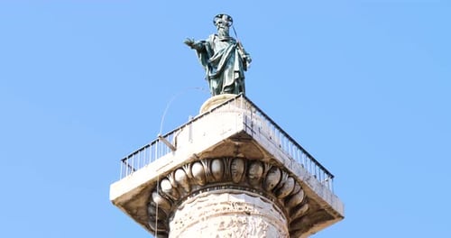 Saint Paul statue on top of the Column of Marcus Aurelius in Rome, Italy.