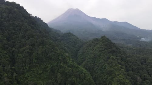 Aerial view of Merapi Mountain in indonesia with tropical forest around it