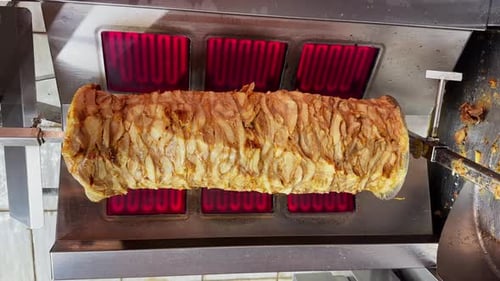 Preparing to cook Doner Kebab in restaurant, shawarma grilled skewered chicken on spit