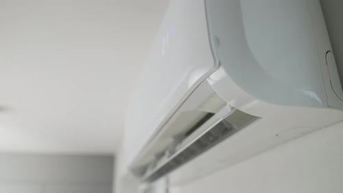 White Air Conditioner Mounted on a Home Wall