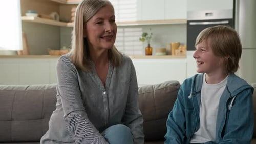 Woman and Child Chatting on Couch