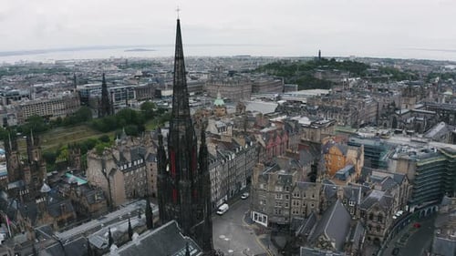 Amazing cityscape of Edinburgh reveal from The Hub gothic building in old town. Cloudy morning in Sc