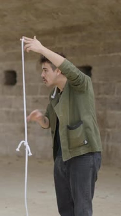 Magician Show Focus with Rope Close Up Shot of Magician Showing Rope Magic Show in the Street