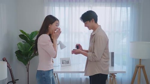 Man Proposes to Woman with Engagement Ring