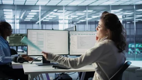 Employees Working at Computers in a Modern Office