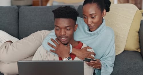 Couple Shopping Online with Laptop at Home
