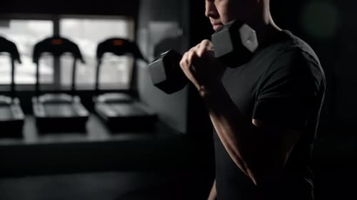 A Solitary Figure Clad in Athletic Attire Pushes Their Physical Limits Their Flexed Elbow and