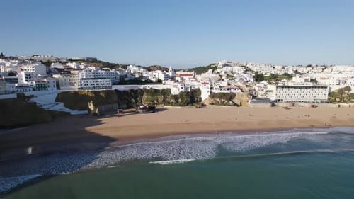 Scenic town by the sea, rocky cliffs, Albufeira in Portugal, drone establisher