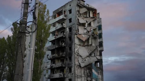 Destroyed Residential Building at Background of Blue and Pink Cloud on Evening Sky in Kiev Ukraine