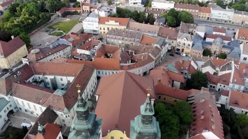 Flying over a twin towered yellow church