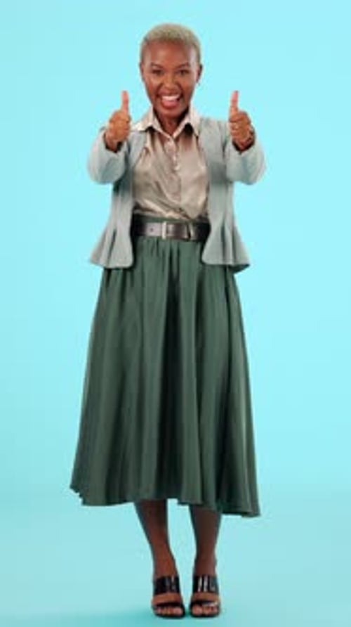 Smiling Woman Gives Thumbs Up Gesture