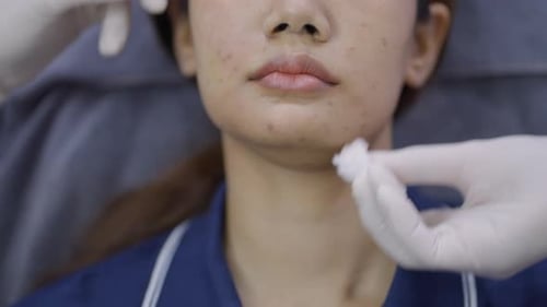 Woman Receiving Facial Treatment