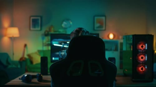 Man Plays Video Game in Blue Lit Room
