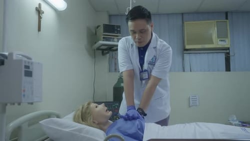 Doctor Performs CPR on Patient in Hospital Room