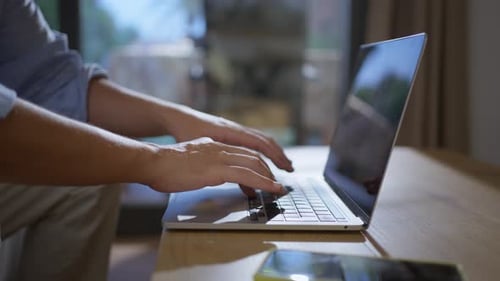 Close Up of Caucasian Millennial Hands Typing on Laptop at Home