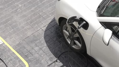 Progressive innovation urban electric on-street charging station with EV car.