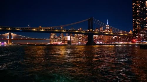 Distancing from the Manhattan Bridge and Brooklyn Bridge on boat.