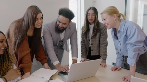 A Group of Diverse Professionals is Collaborating Effectively in a Modern Office Environment