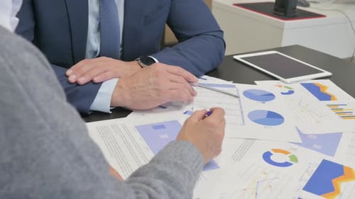 Close up of Business People Working on Documents