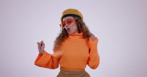 Dance, celebration and face of woman in studio excited for news, announcement