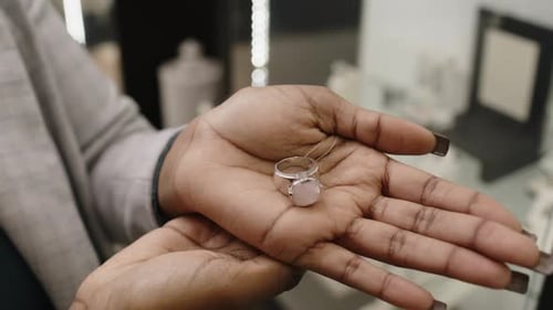 Elegant Ring in Palm of Hand in Store