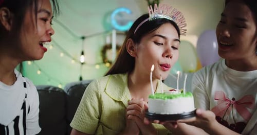 Women Celebrate Birthday with Cake and Gifts
