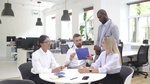 Multiethnic Business People During Meeting in Modern Office